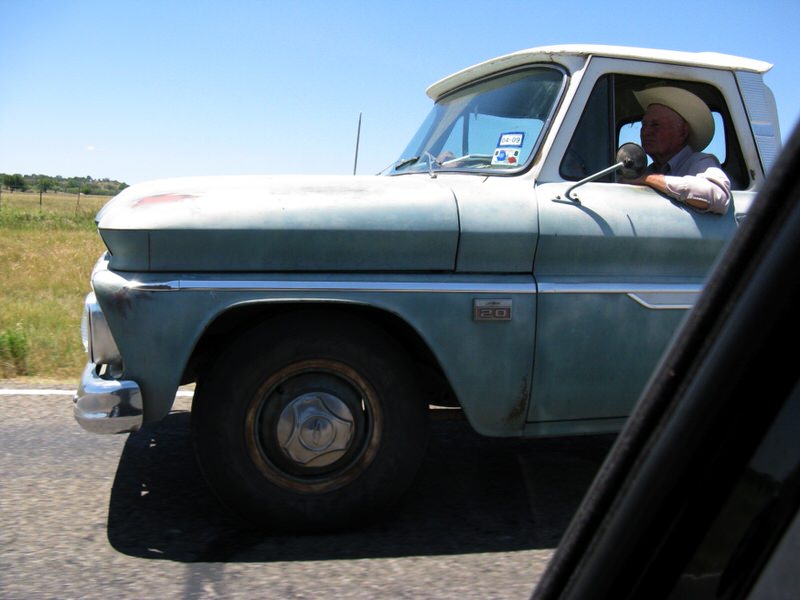 Old man driving vintage truck